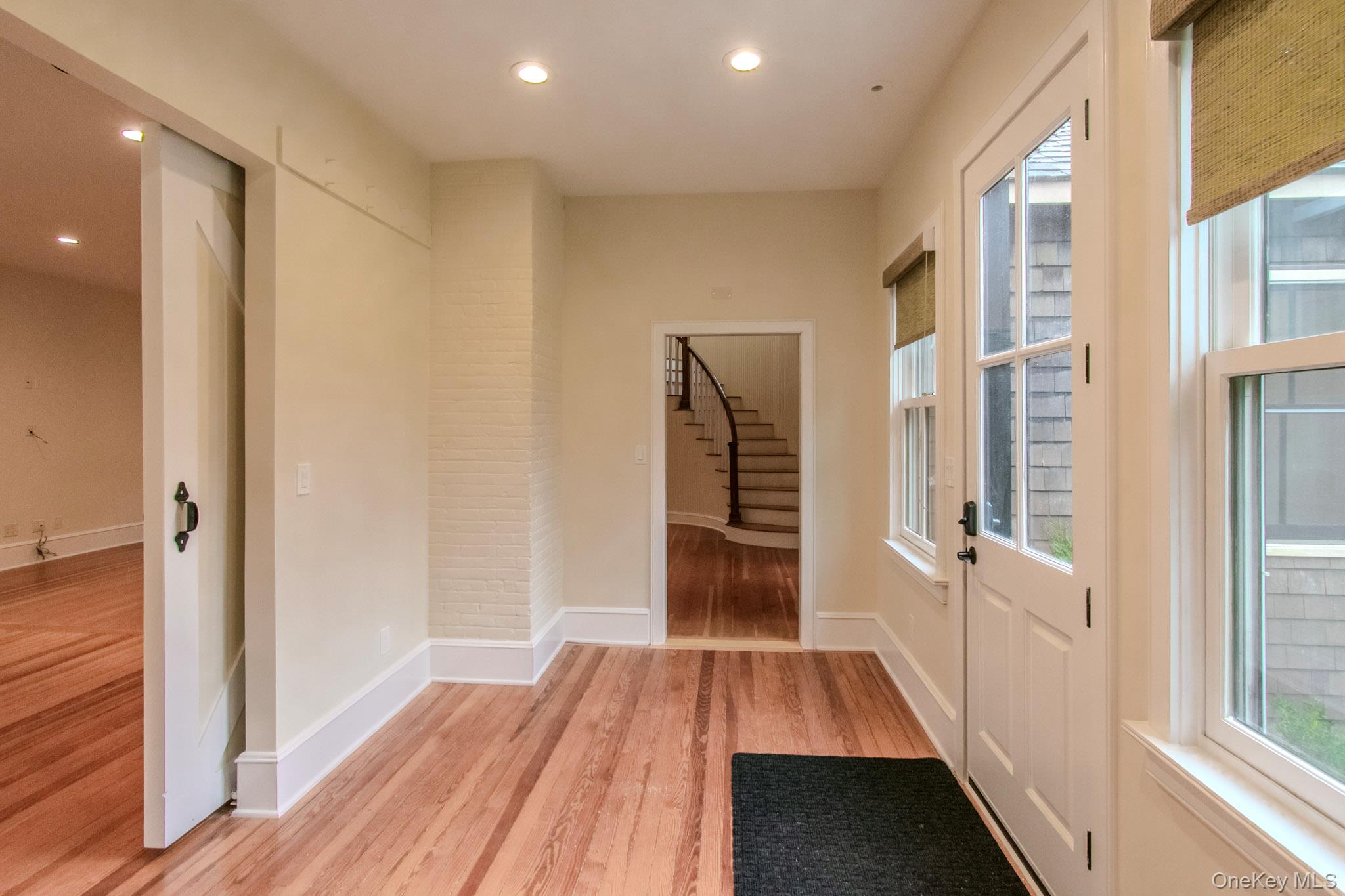 54 East Lake Stable Road Tuxedo Park, NY 10987 - Photo 5 of 31 Doorway with light hardwood / wood-style floors and a healthy amount of sunlight