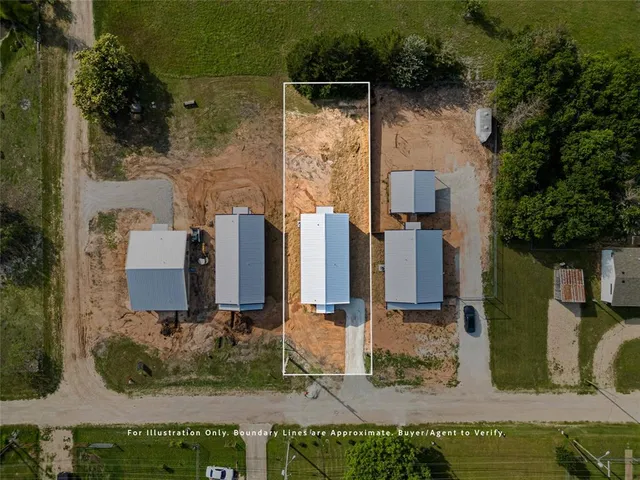an aerial view of a house with outdoor space