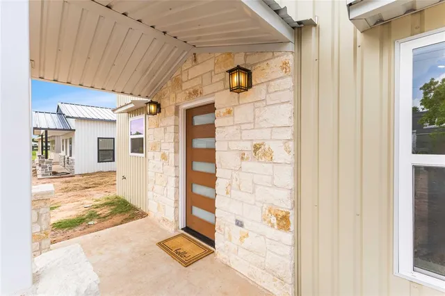 a view of a hallway with wooden walls