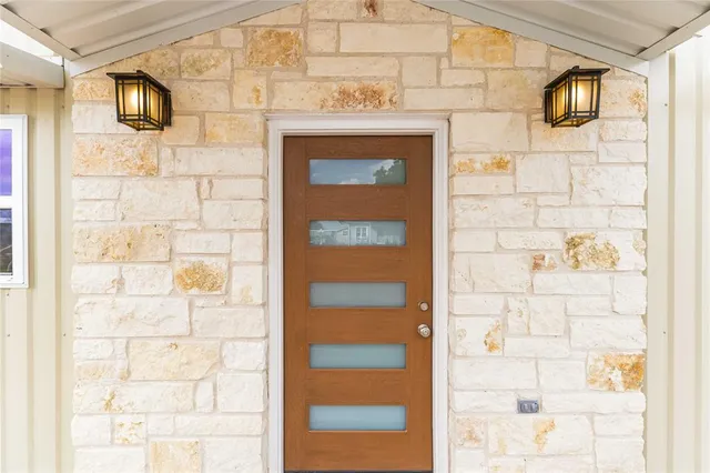 a view of a door with a glass door shower