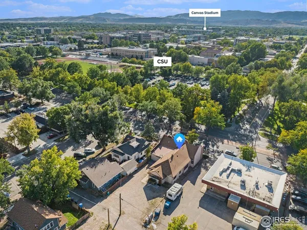 an aerial view of residential house with outdoor space
