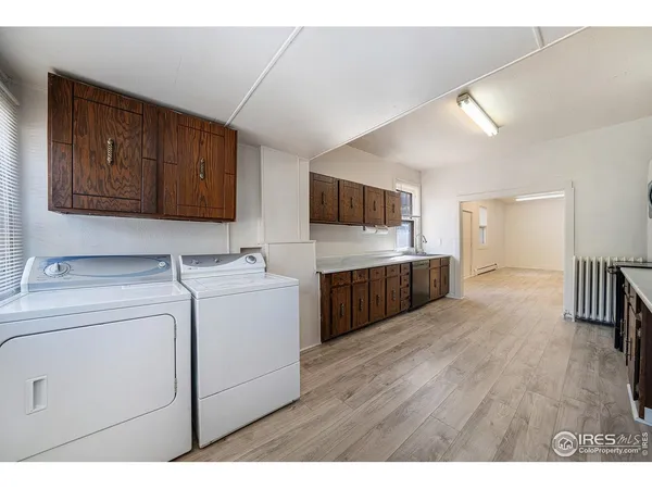 a kitchen with a stove a sink and a refrigerator