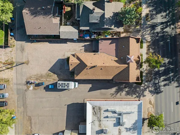 an aerial view of a house with swimming pool