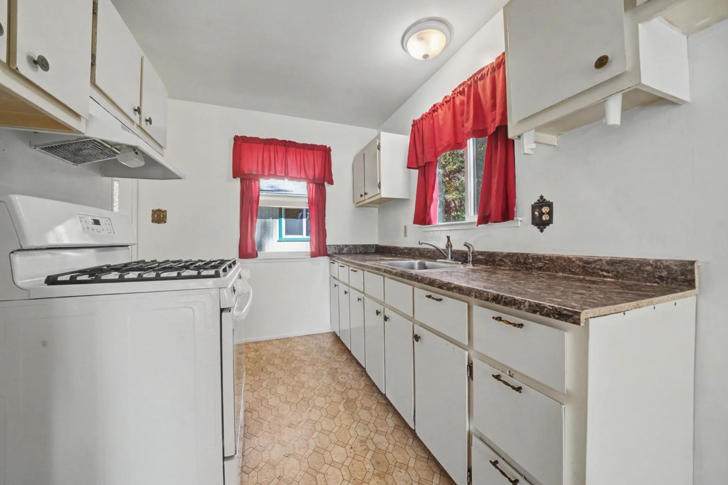 14371 Tobacco Road Pine Grove, CA 95665 - Photo 11 of 38 a kitchen with stainless steel appliances granite countertop a sink and a refrigerator
