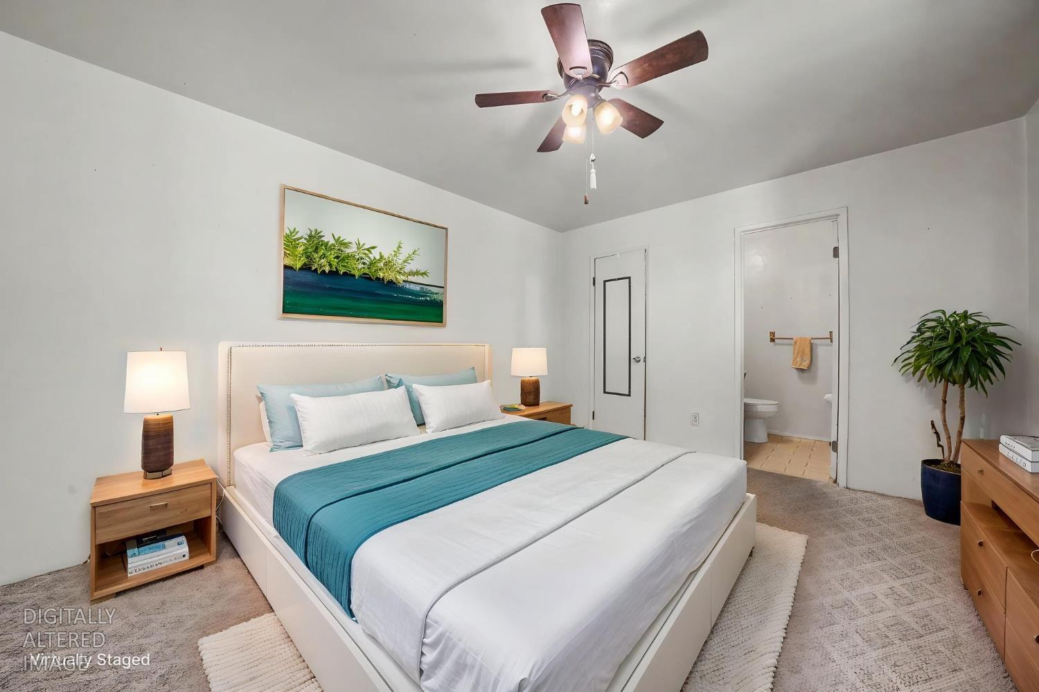 14371 Tobacco Road Pine Grove, CA 95665 - Photo 13 of 38 a bedroom with a bed and a chandelier