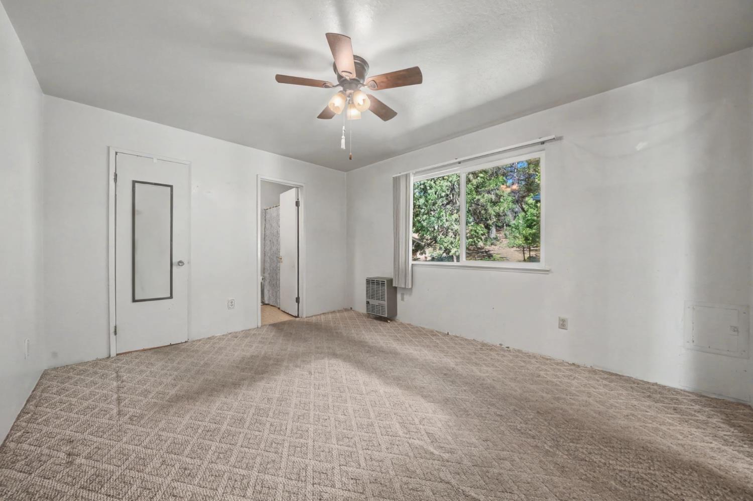 14371 Tobacco Road Pine Grove, CA 95665 - Photo 16 of 38 a view of a livingroom with a ceiling fan and window