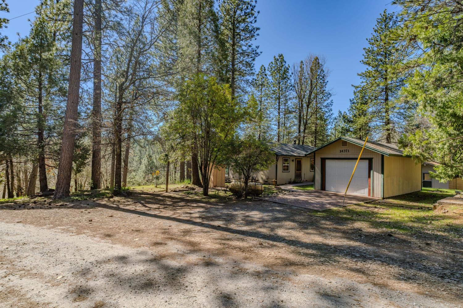 14371 Tobacco Road Pine Grove, CA 95665 - Photo 27 of 38 a view of a house with a yard