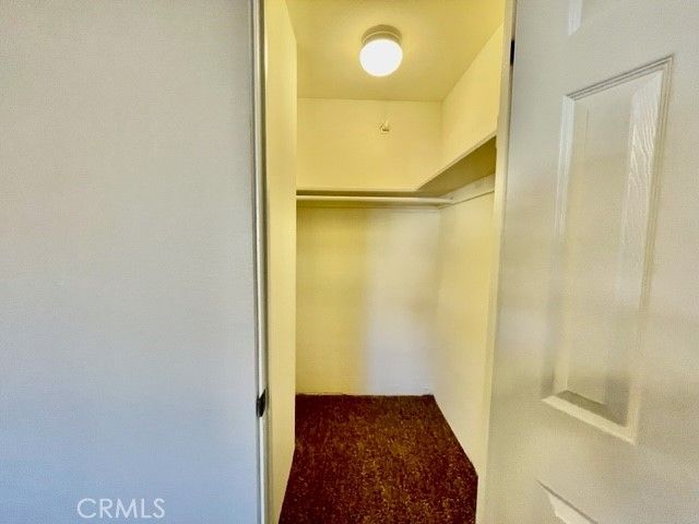 a bathroom with a glass door shower