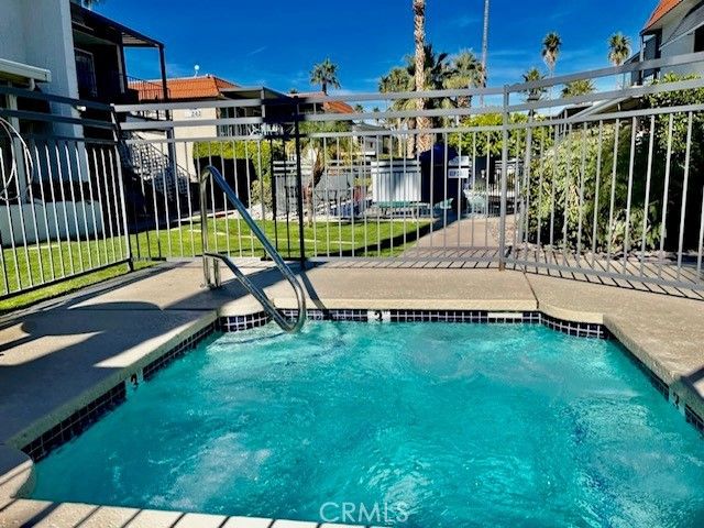 a view of a patio with a table and chairs