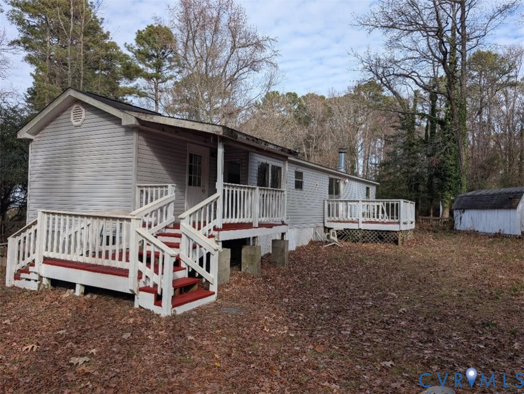 947 South Salisbury Road Hague, VA 22469 - Photo 2 of 10 a view of a house with a yard and deck area