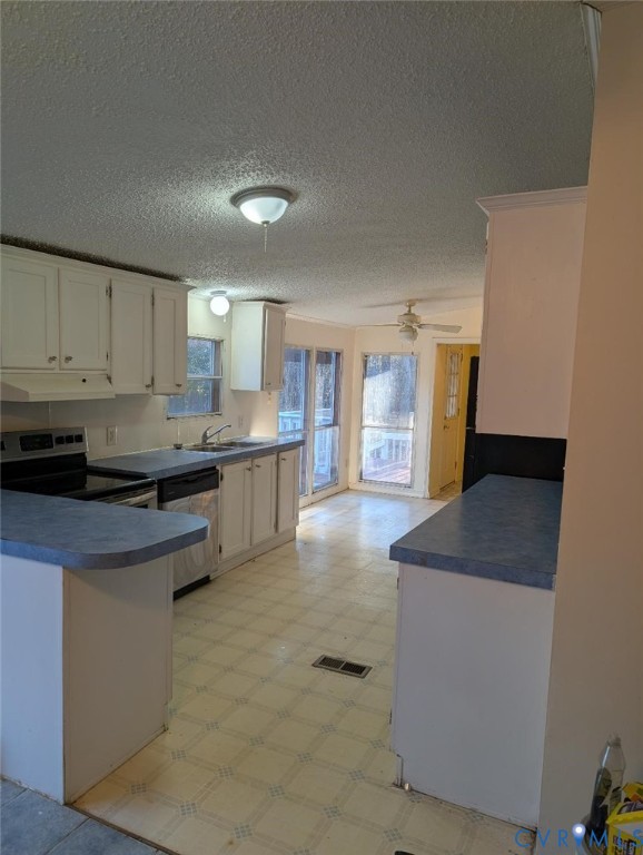 947 South Salisbury Road Hague, VA 22469 - Photo 5 of 10 a kitchen with stainless steel appliances granite countertop a stove a sink and a refrigerator