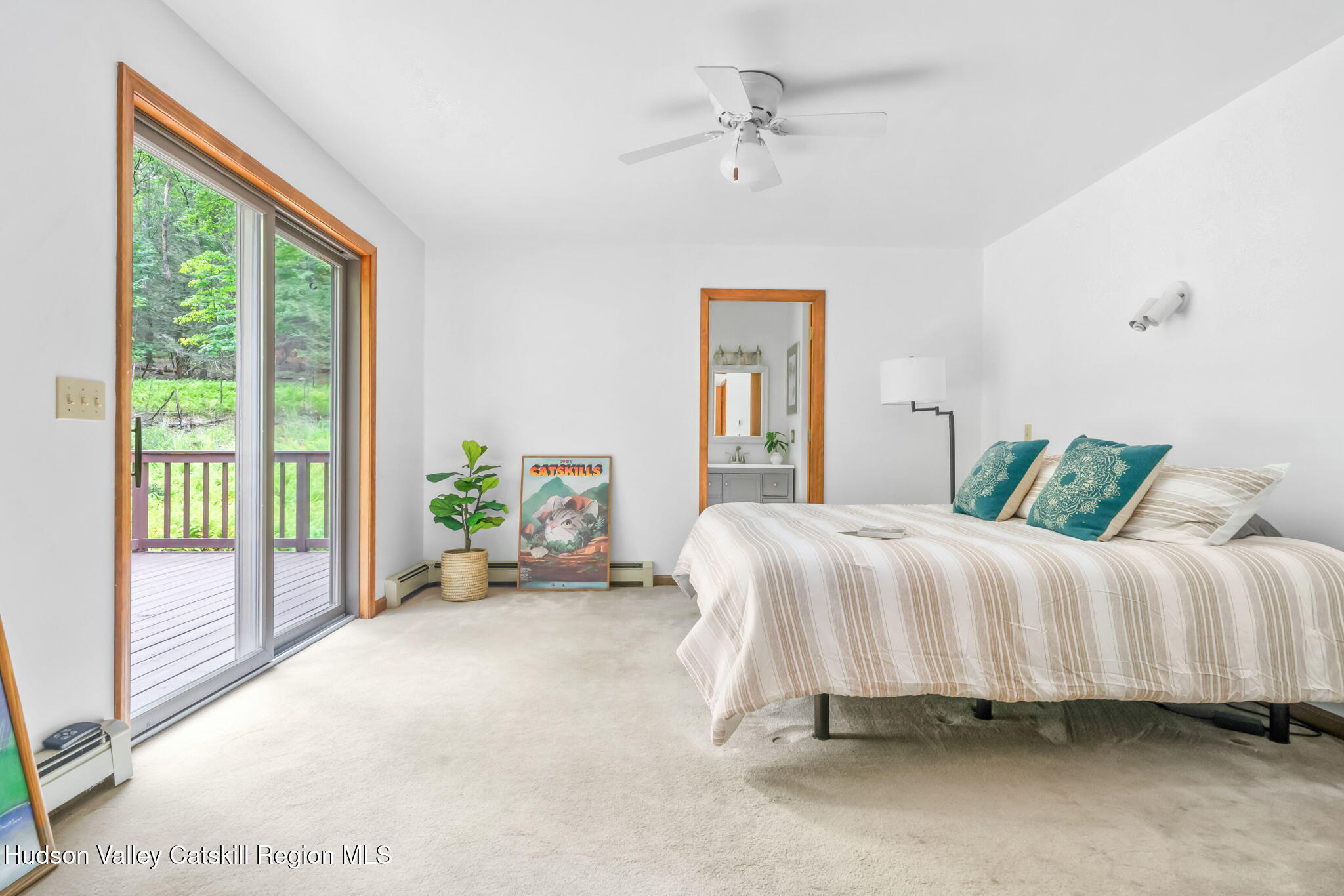 650 Beaverkill Road Olivebridge, NY 12461 - Photo 15 of 31 a spacious bedroom with a bed and ceiling fan