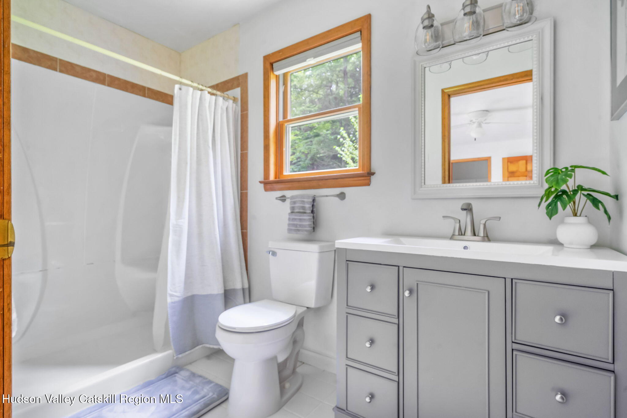 650 Beaverkill Road Olivebridge, NY 12461 - Photo 17 of 31 a bathroom with a toilet sink and mirror