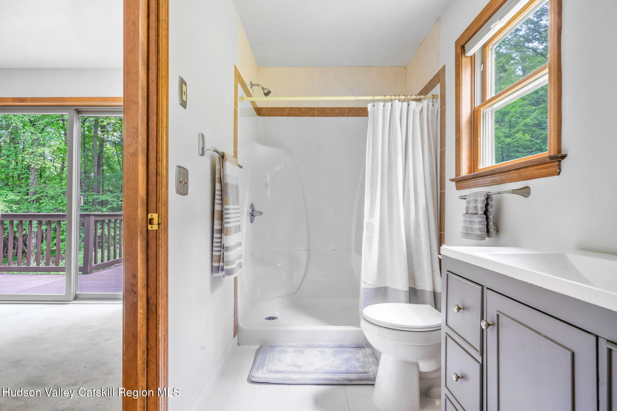 650 Beaverkill Road Olivebridge, NY 12461 - Photo 18 of 31 a bathroom with a granite countertop shower a toilet and a sink