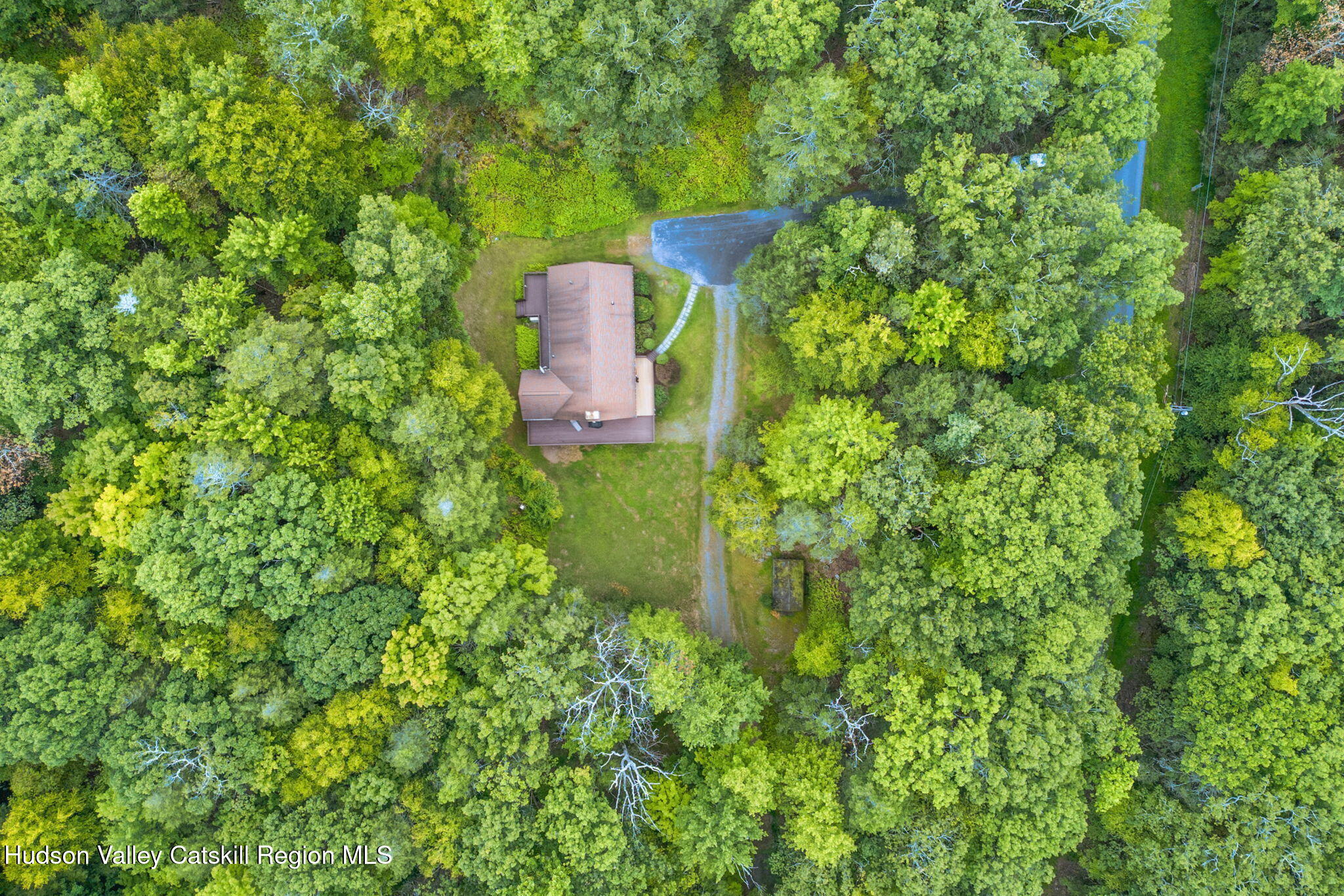 650 Beaverkill Road Olivebridge, NY 12461 - Photo 2 of 31 a backyard of a house with table and chairs