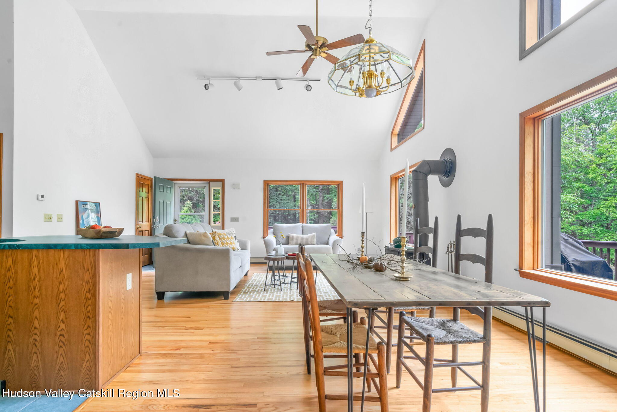 650 Beaverkill Road Olivebridge, NY 12461 - Photo 7 of 31 a dining room with furniture a chandelier and wooden floor