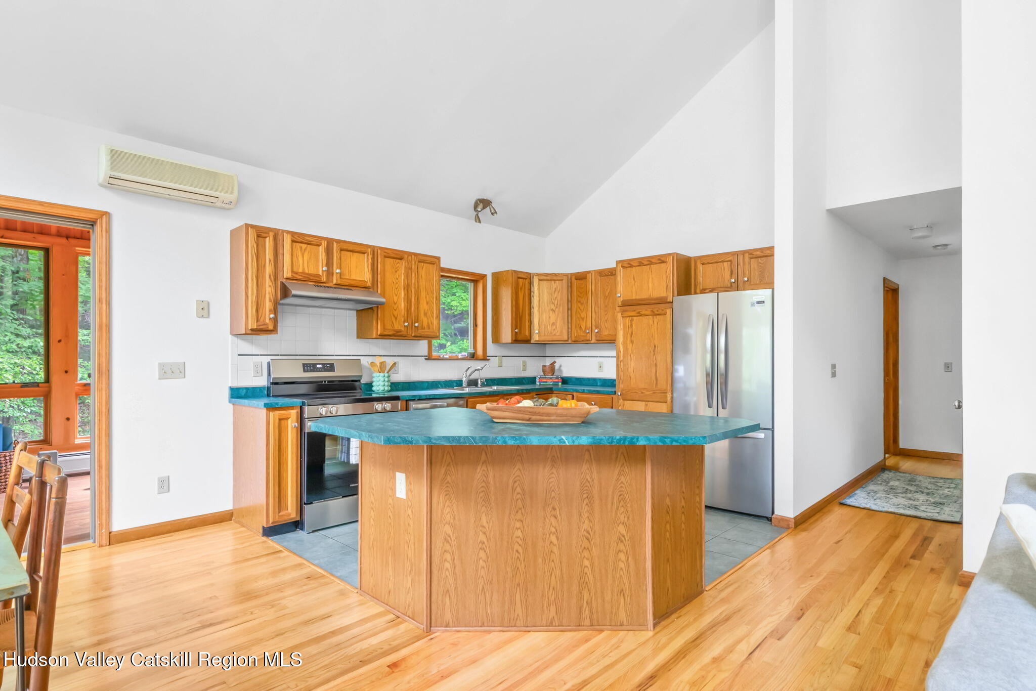 650 Beaverkill Road Olivebridge, NY 12461 - Photo 9 of 31 a kitchen with stainless steel appliances granite countertop a sink and a refrigerator