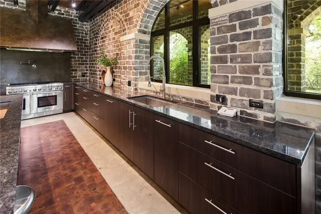 a bathroom with a sink a toilet a mirror and shower