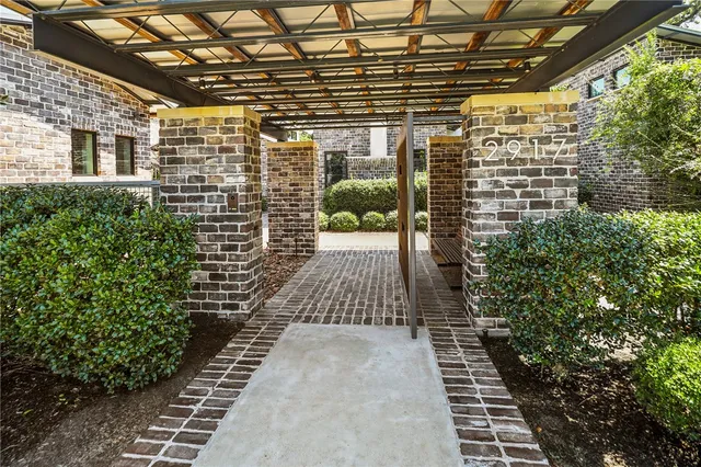 a view of a brick building with many windows