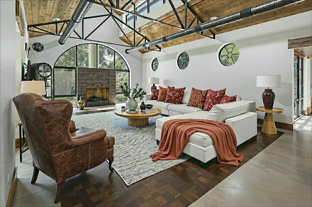 a kitchen with stainless steel appliances kitchen island granite countertop a stove and a refrigerator