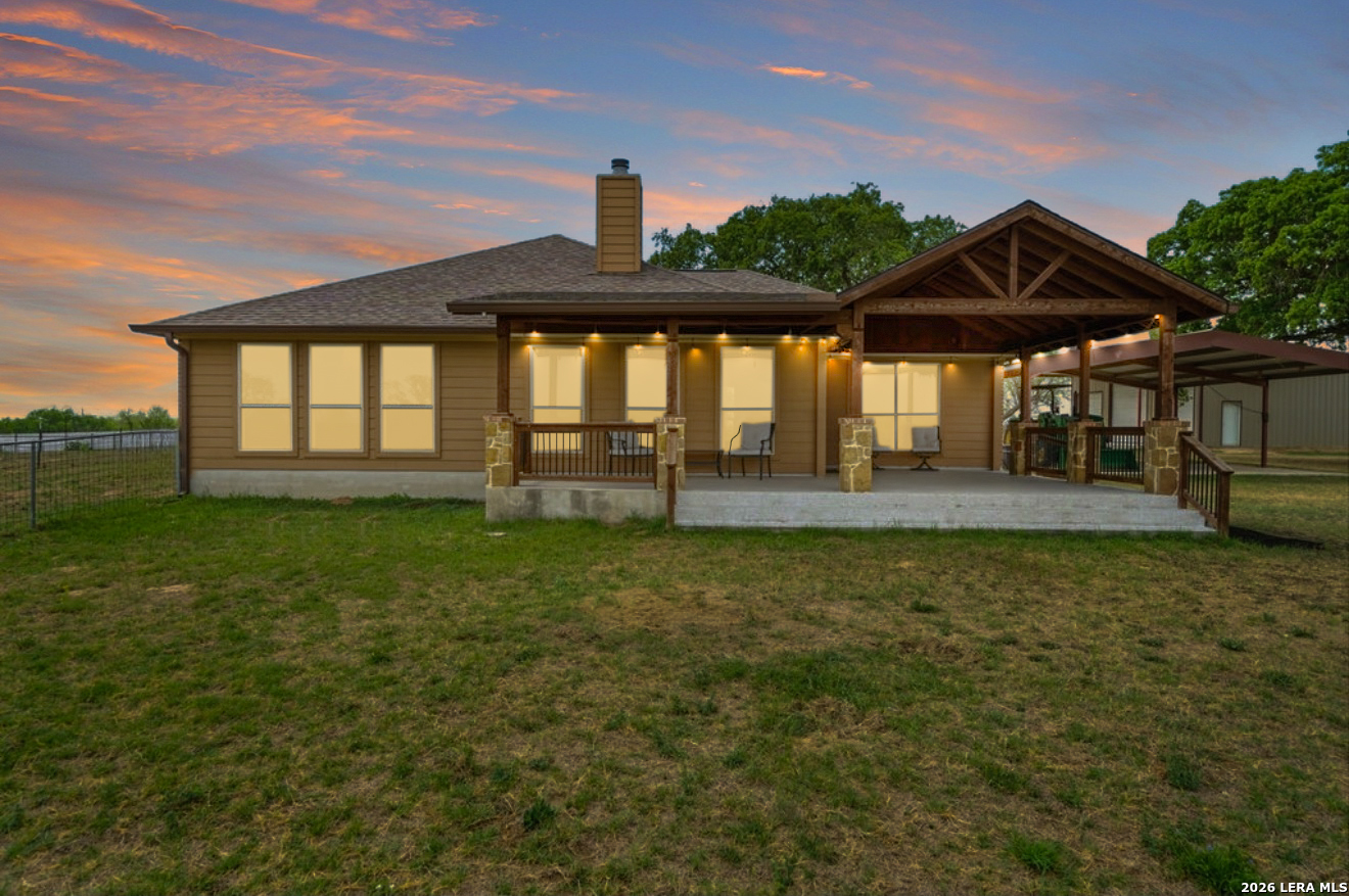12897 La Vernia Road St. Hedwig, TX 78152 - Photo 3 of 34 a front view of a house with garden