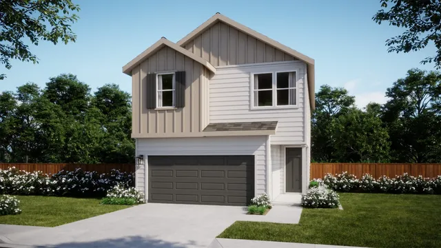 a front view of a house with a garden and plants