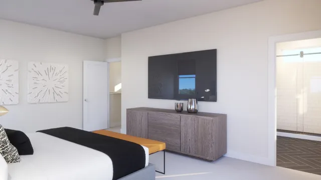 a bedroom with a bed and a bathroom