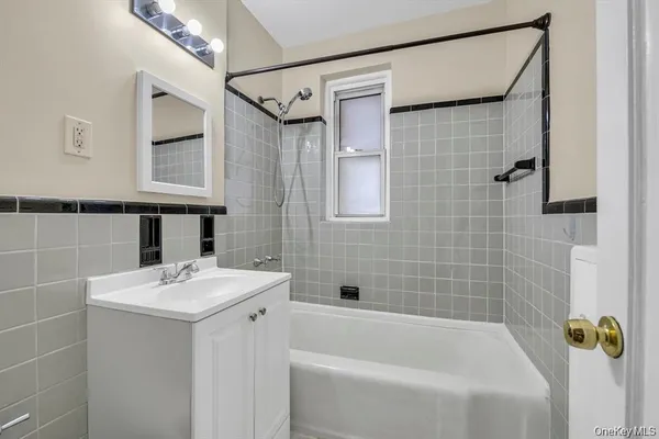 a bathroom with a sink and shower