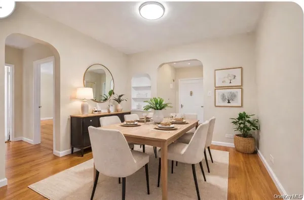 a dining room with furniture and wooden floor