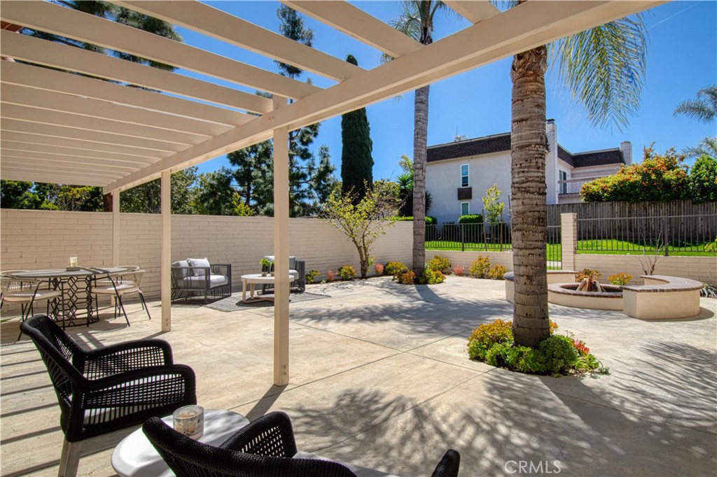 39 Seton Road Irvine, CA 92612 - Photo 19 of 28 a view of a patio with a table and chairs and potted plants