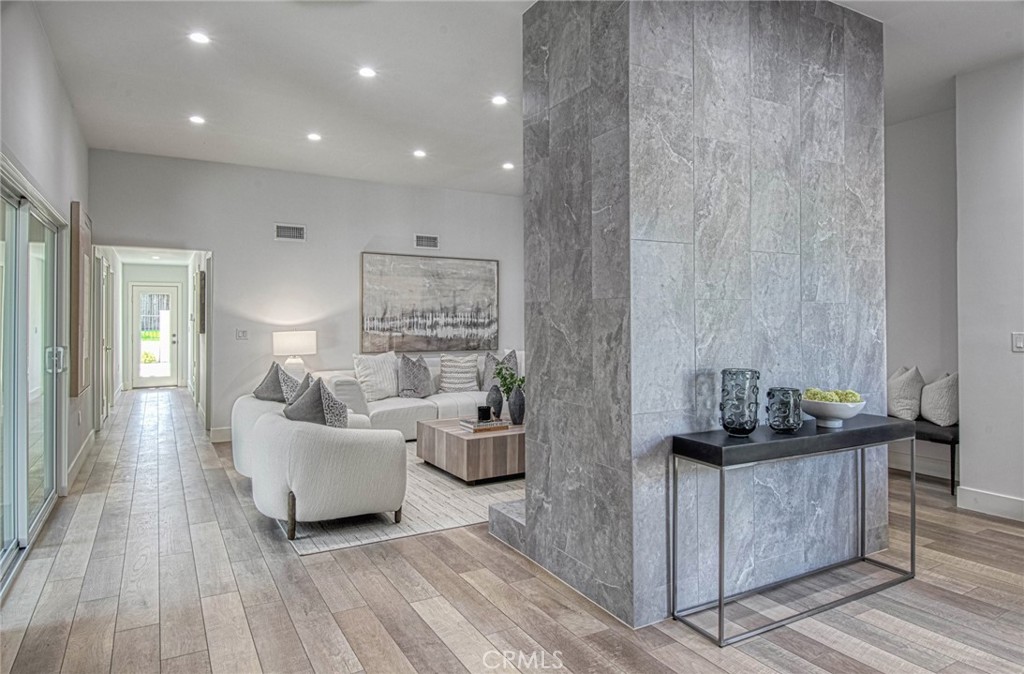 39 Seton Road Irvine, CA 92612 - Photo 10 of 28 a living room with furniture and wooden floor
