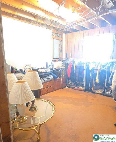 1107 Hampstead Court Bushkill, PA 18324 - Photo 8 of 17 a living room with furniture a chandelier and a window
