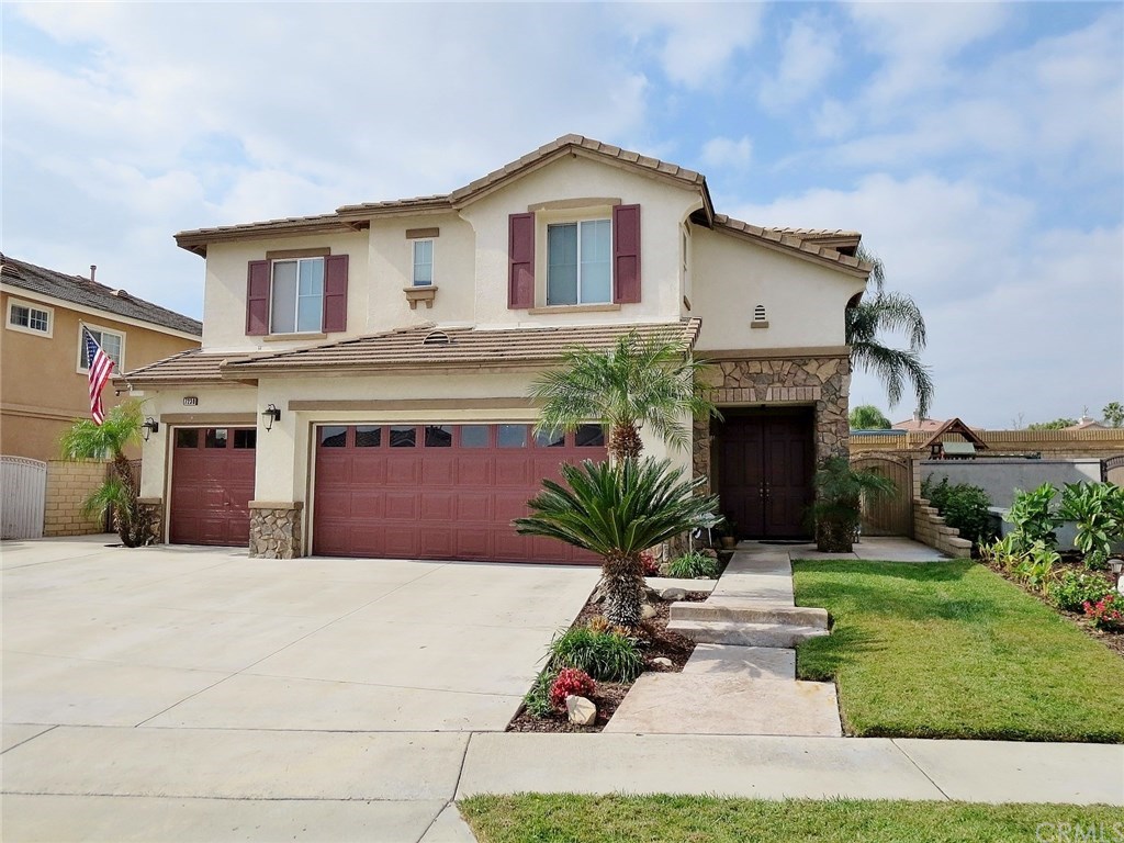 7230 Townsend Court Rancho Cucamonga, CA 91739 - Photo 1 of 1 a front view of a house with a yard and garage