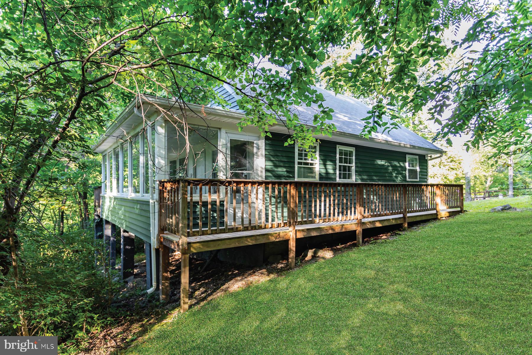 437 Joans Quadrangle Road Front Royal, VA 22630 - Photo 6 of 17 an outdoor view of house with yard and trees