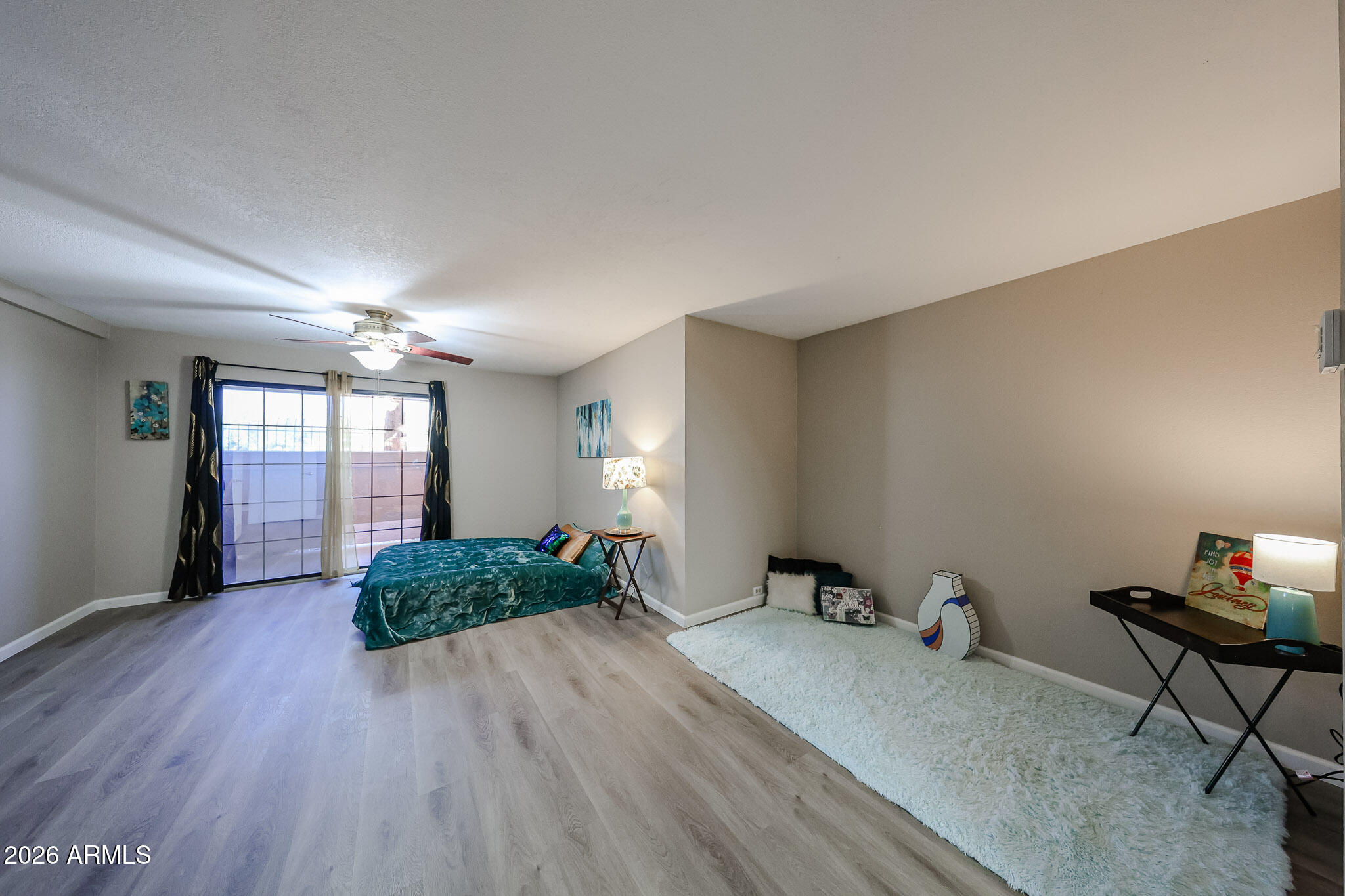 10410 North Cave Creek Road, Unit 1011 Phoenix, AZ 85020 - Photo 16 of 54 a room with furniture and wooden floor