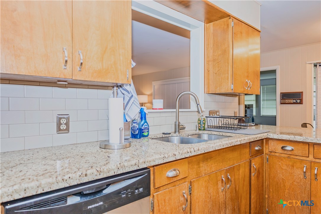 111 Dover Dell Street Victoria, TX 77904 - Photo 16 of 36 a kitchen with stainless steel appliances granite countertop a sink and a window