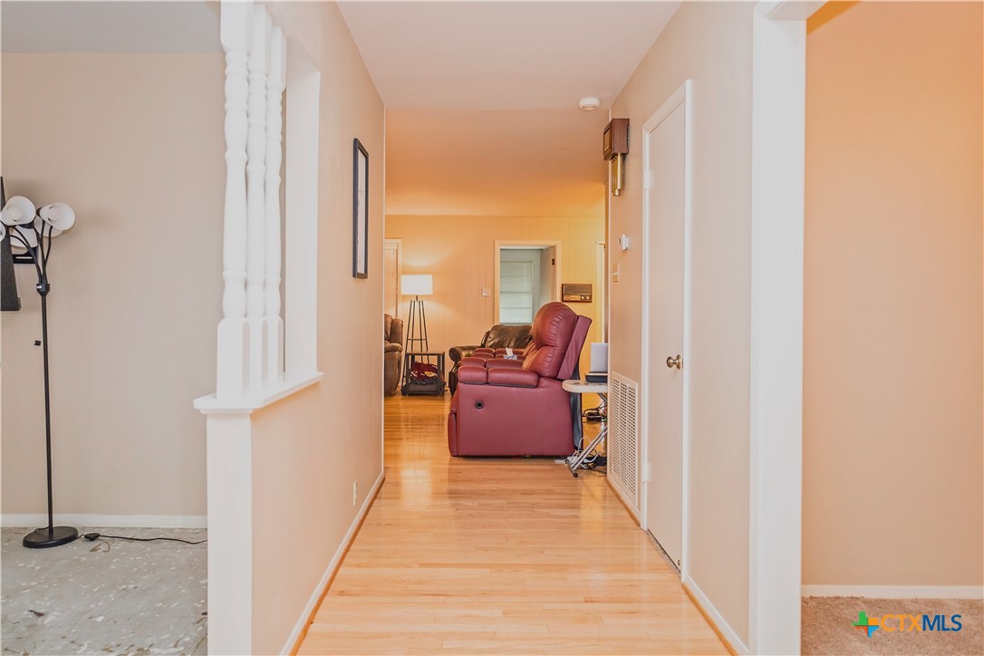 111 Dover Dell Street Victoria, TX 77904 - Photo 2 of 36 a view of living room with furniture and floor to ceiling window