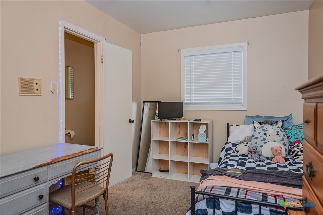 111 Dover Dell Street Victoria, TX 77904 - Photo 22 of 36 a bedroom with a bed and a window