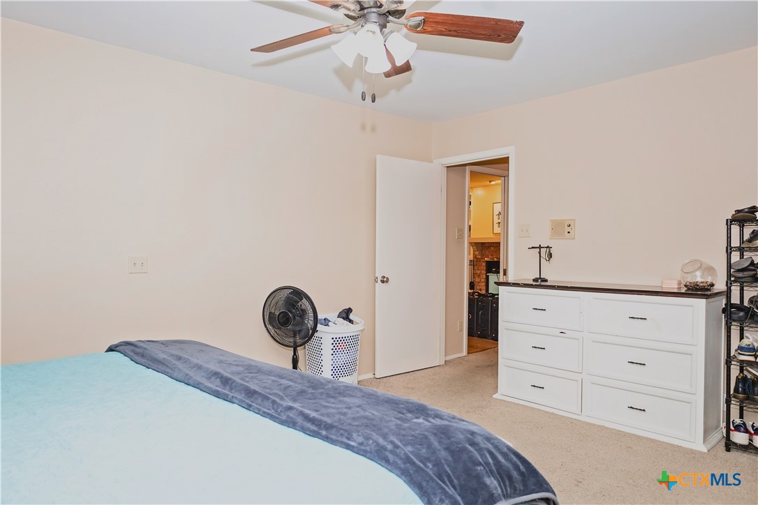 111 Dover Dell Street Victoria, TX 77904 - Photo 28 of 36 a bedroom with a bed and a dresser