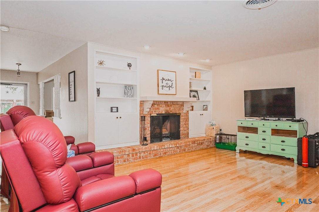 111 Dover Dell Street Victoria, TX 77904 - Photo 10 of 36 a living room with furniture and a flat screen tv
