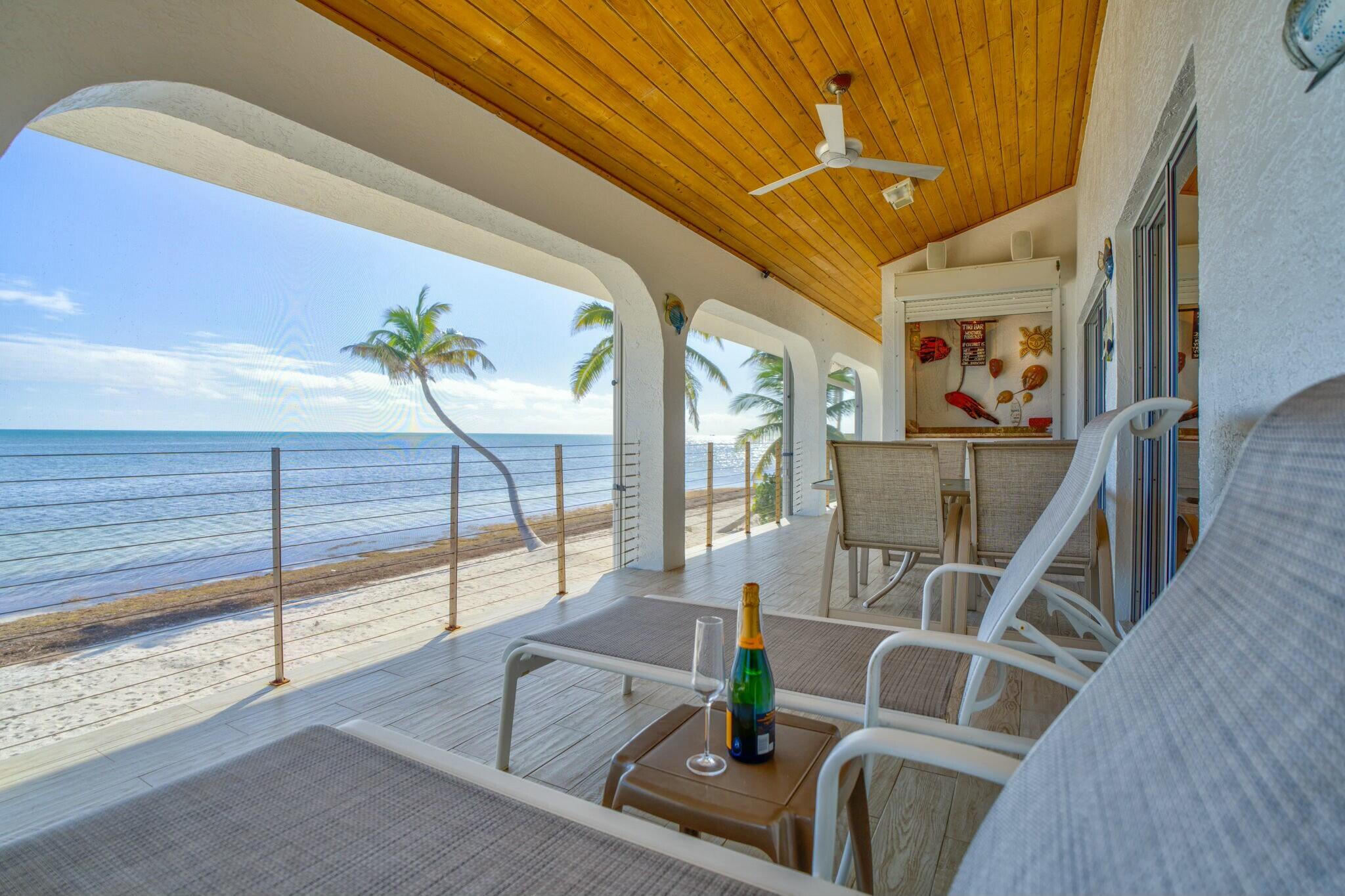1073 Long Beach Drive Big Pine Key, FL 33043 - Photo 20 of 55 a view of living room with furniture and a table