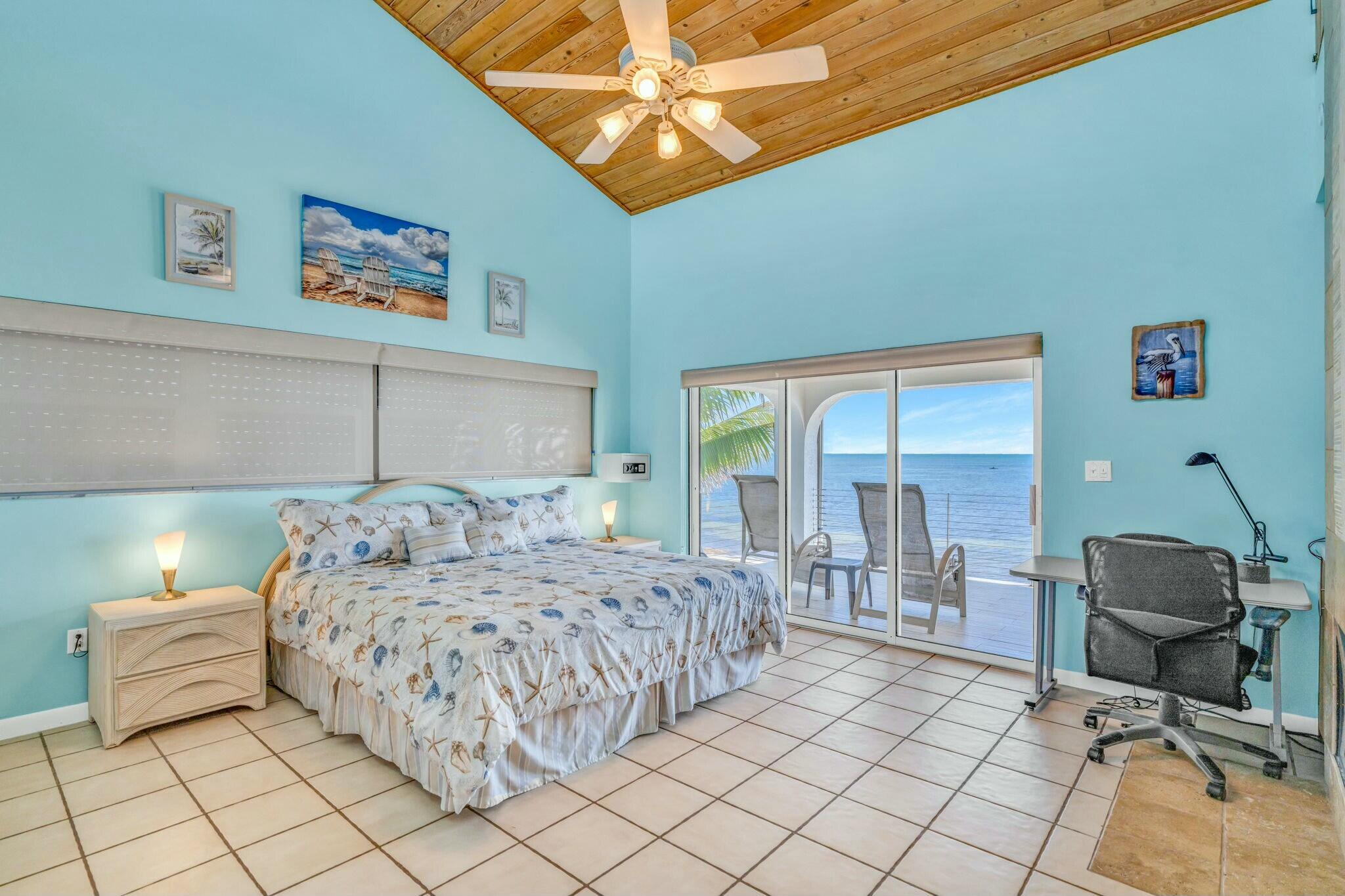 1073 Long Beach Drive Big Pine Key, FL 33043 - Photo 22 of 55 a bedroom with a bed and furniture