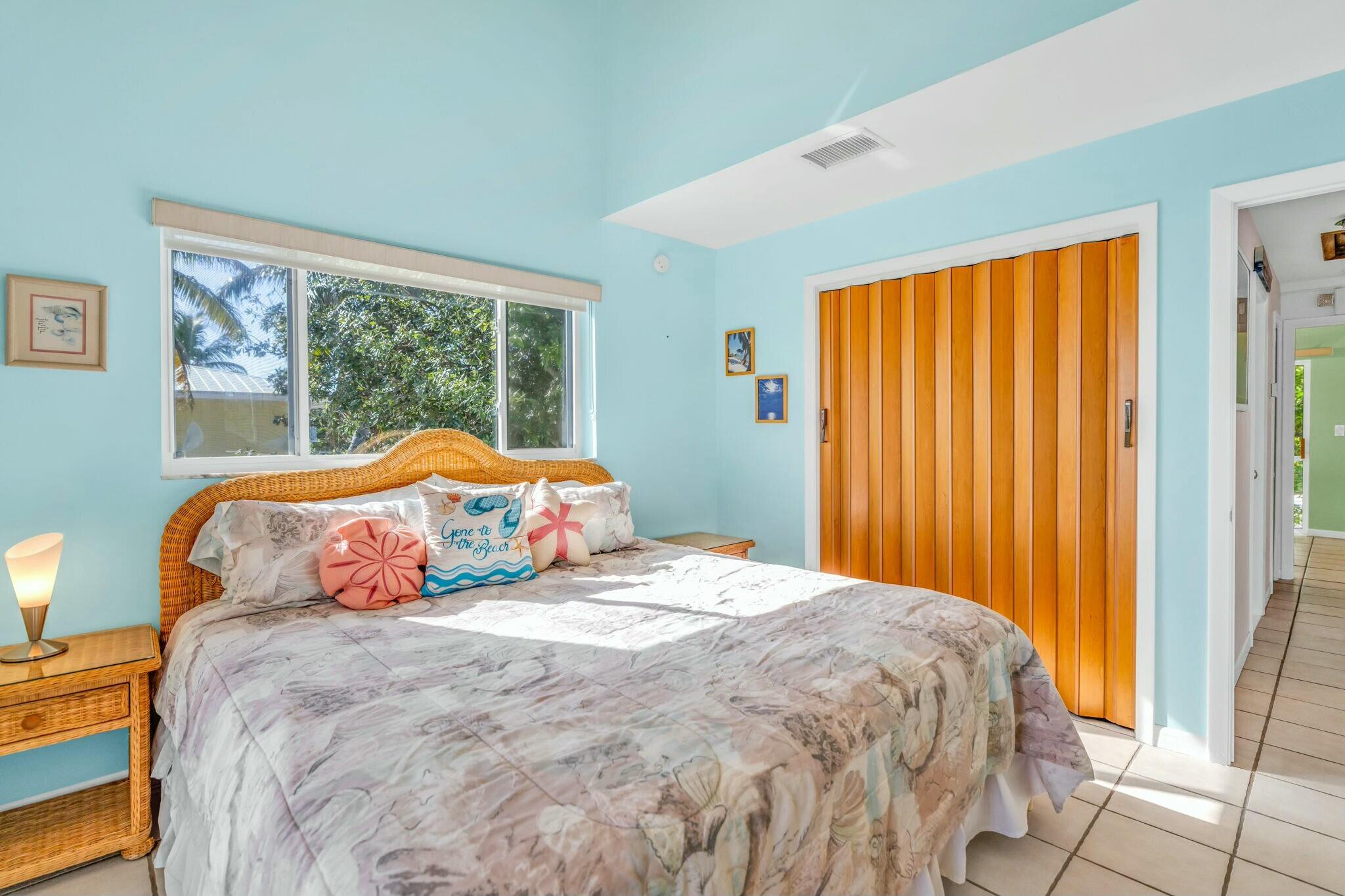 1073 Long Beach Drive Big Pine Key, FL 33043 - Photo 29 of 55 a bedroom with a bed and a window