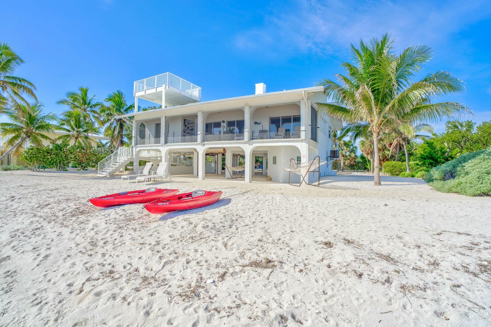 1073 Long Beach Drive Big Pine Key, FL 33043 - Photo 3 of 55 a front view of a house with porch