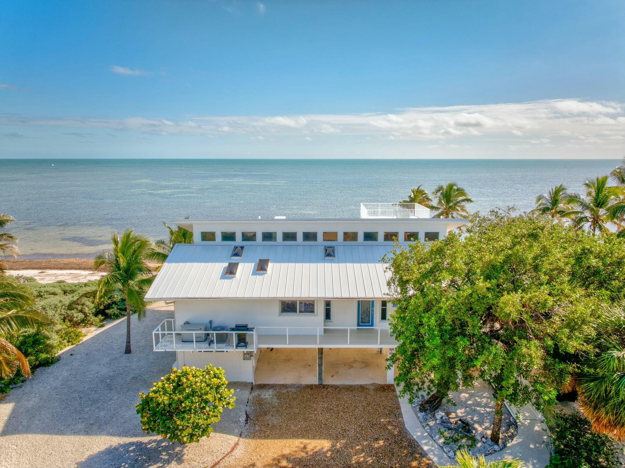 1073 Long Beach Drive Big Pine Key, FL 33043 - Photo 45 of 55 a picture of a building with a outdoor space