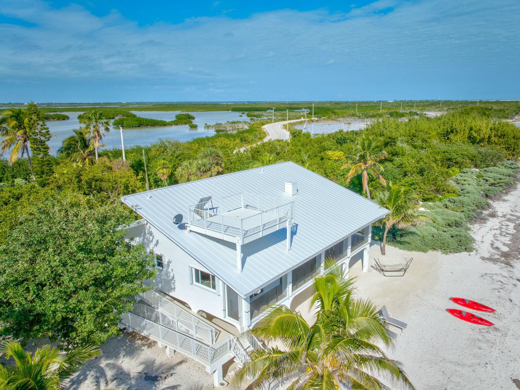 1073 Long Beach Drive Big Pine Key, FL 33043 - Photo 47 of 55 an aerial view of a house with a yard