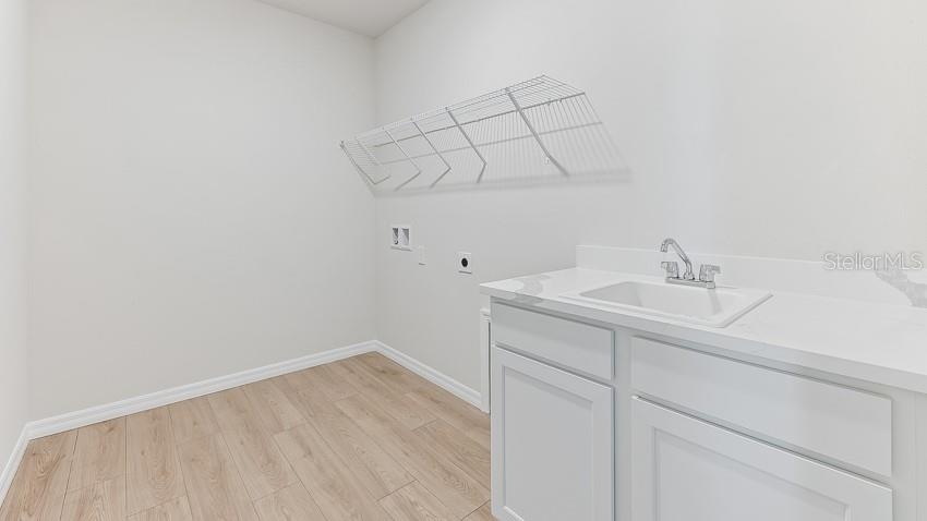 1925 Cobb Trail Parrish, FL 34219 - Photo 20 of 25 a bathroom with a sink vanity and vanity