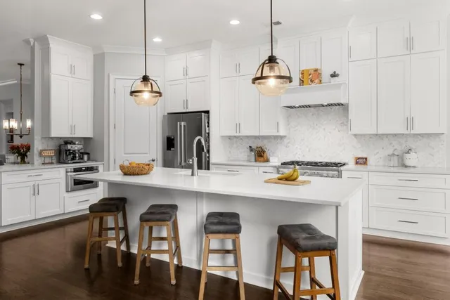 a bedroom with bed couch and window