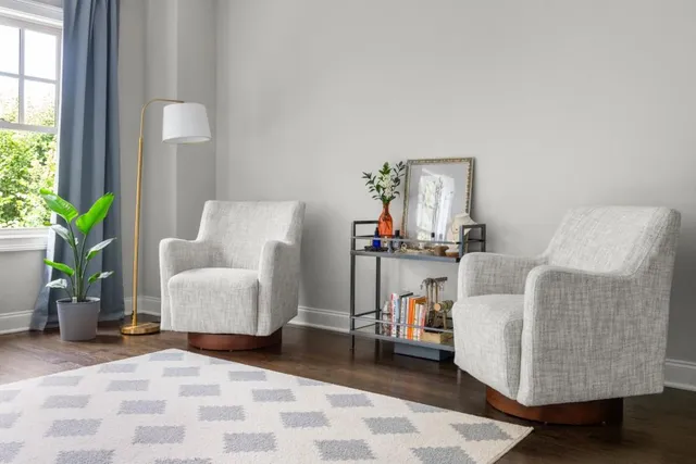 a bathroom with a sink a potted plant and a window