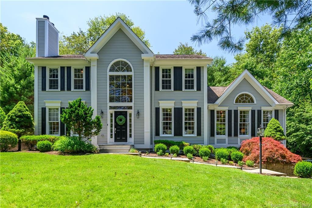7 Cranbury Road Norwalk, CT 06851 - Photo 1 of 1 a front view of a house with a yard and garage